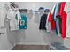 Organized walk-in closet with shelving and hanging space for clothes, shirts and jerseys, maximizing storage potential at 244 Jasper Overlook Way # 244, Myrtle Beach, SC 29588