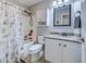 Bathroom with a tub shower, white cabinets, granite countertops, and neutral walls at 2479 Burning Tree Ln., Little River, SC 29566
