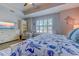 Bedroom with shuttered windows, a bookcase, nautical decor, and hard floors at 2479 Burning Tree Ln., Little River, SC 29566