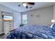 Comfortable bedroom featuring beachy decor, ceiling fan, and a TV on the dresser at 2479 Burning Tree Ln., Little River, SC 29566