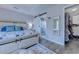 Bedroom showing ensuite bathroom and walk-in closet, nautical decor, hard floors at 2479 Burning Tree Ln., Little River, SC 29566