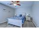 Bedroom with a queen bed, two end tables, ceiling fan and laminate wood flooring at 2479 Burning Tree Ln., Little River, SC 29566