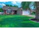 Charming single-story home with a manicured lawn and a two-car garage, complemented by vibrant flower beds at 2479 Burning Tree Ln., Little River, SC 29566