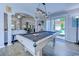 Spacious game room featuring a pool table, stylish lighting, and access to the outdoor patio at 2479 Burning Tree Ln., Little River, SC 29566