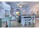 Bright and airy living room with hardwood floors, ceiling fan, coastal decor, and comfortable seating at 2479 Burning Tree Ln., Little River, SC 29566