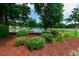 Community pond with picnic tables, mature landscaping, and a water fountain at 2479 Burning Tree Ln., Little River, SC 29566