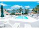 Community pool with lounge chairs, a gazebo, and a surrounding fence at 2479 Burning Tree Ln., Little River, SC 29566