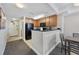 Kitchen with wood cabinets, black appliances, and a view to the dining area at 2600 N Ocean Blvd. # 1914, Myrtle Beach, SC 29577