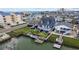 Aerial view of a coastal home featuring a backyard with water access and surrounding neighborhood at 302 46Th Ave. N, North Myrtle Beach, SC 29582