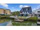 Waterfront home with a private dock, fenced yard, canal access, and stilted construction at 302 46Th Ave. N, North Myrtle Beach, SC 29582