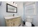 This bathroom offers light blue walls and a vintage vanity at 302 46Th Ave. N, North Myrtle Beach, SC 29582