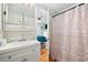 A shared bathroom with a bedroom view and a shower curtain at 302 46Th Ave. N, North Myrtle Beach, SC 29582