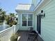 Relaxing balcony area with seating and a view of the nearby pond and landscaping at 312 Shelly Bay Ct., Surfside Beach, SC 29575