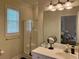 Bright bathroom featuring a single vanity, and a tiled shower, creating a relaxing atmosphere at 312 Shelly Bay Ct., Surfside Beach, SC 29575