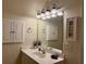 Bright bathroom features a single sink vanity, decorative lighting, and framed artwork at 312 Shelly Bay Ct., Surfside Beach, SC 29575