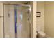 Bathroom with glass enclosed standing shower and toilet at 312 Shelly Bay Ct., Surfside Beach, SC 29575