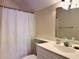 Clean bathroom featuring a well-lit vanity, sink, and a shower with a white curtain at 312 Shelly Bay Ct., Surfside Beach, SC 29575
