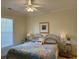 Bright bedroom featuring a bed, window, ceiling fan, and bedside tables, creating a relaxing atmosphere at 312 Shelly Bay Ct., Surfside Beach, SC 29575