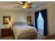 Cozy bedroom with a comfortable bed, ceiling fan, soft lighting, and a window offering natural light at 312 Shelly Bay Ct., Surfside Beach, SC 29575