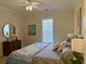 Cozy bedroom featuring a colorful bed, window, bedside tables, creating a relaxing atmosphere at 312 Shelly Bay Ct., Surfside Beach, SC 29575