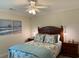 Comfortable bedroom with tropical themed decor and a ceiling fan at 312 Shelly Bay Ct., Surfside Beach, SC 29575
