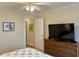 Bedroom featuring a dresser with a television and a comfortable bed, perfect for relaxing evenings at 312 Shelly Bay Ct., Surfside Beach, SC 29575