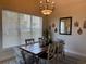 Charming dining room with modern chandelier and natural light at 312 Shelly Bay Ct., Surfside Beach, SC 29575