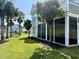 Home featuring a screened porch, a view of the lake, and manicured landscaping at 312 Shelly Bay Ct., Surfside Beach, SC 29575