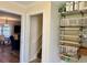 Well-organized hallway with shelving and pantry storage, providing convenient access to the living area at 312 Shelly Bay Ct., Surfside Beach, SC 29575