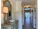 Inviting hallway featuring tile flooring, crown molding, decorative furnishings and a skylight offering natural light at 312 Shelly Bay Ct., Surfside Beach, SC 29575