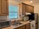 Efficient kitchen with essential appliances, plenty of counter space, and natural light from the window at 312 Shelly Bay Ct., Surfside Beach, SC 29575