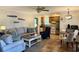Open-concept living room with a comfortable sofa, inviting decor, and an adjacent dining area at 312 Shelly Bay Ct., Surfside Beach, SC 29575
