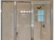 Glass enclosed shower featuring tile and fixtures. Window offers natural light at 312 Shelly Bay Ct., Surfside Beach, SC 29575