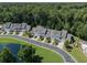 Well-maintained townhomes, featuring pond views and surrounded by lush trees at 315 Bulkhead Bend # 315, Carolina Shores, NC 28467