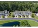 Charming townhomes nestled in a tranquil community with pond views and lush greenery at 315 Bulkhead Bend # 315, Carolina Shores, NC 28467