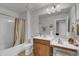 Well-lit bathroom features a shower-tub combo, vanity, and ample counter space at 315 Bulkhead Bend # 315, Carolina Shores, NC 28467