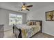 Comfortable bedroom featuring a ceiling fan, window, and cozy bedding at 315 Bulkhead Bend # 315, Carolina Shores, NC 28467