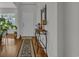 Inviting foyer featuring hardwood floors, a stylish console table with decorative items, and a view of the front door at 315 Bulkhead Bend # 315, Carolina Shores, NC 28467