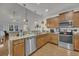 Open kitchen featuring stainless steel appliances, granite countertops, and seamless flow to the living area at 315 Bulkhead Bend # 315, Carolina Shores, NC 28467
