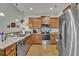 Modern kitchen equipped with stainless steel appliances, granite countertops, and wood cabinetry at 315 Bulkhead Bend # 315, Carolina Shores, NC 28467