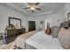 Main bedroom featuring a large dresser, tv, and luxurious king-size bed at 315 Bulkhead Bend # 315, Carolina Shores, NC 28467