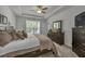Comfortable main bedroom featuring a large window and dresser with lots of personal photos at 315 Bulkhead Bend # 315, Carolina Shores, NC 28467