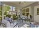 Screened patio with comfortable seating and peaceful outdoor views at 315 Bulkhead Bend # 315, Carolina Shores, NC 28467