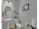 Well-maintained powder room featuring a pedestal sink, toilet, and tasteful decor at 315 Bulkhead Bend # 315, Carolina Shores, NC 28467