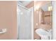 Simple bathroom featuring a glass shower, pedestal sink, and neutral decor at 329 54Th Ave. N, North Myrtle Beach, SC 29582