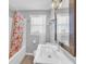 Clean bathroom with starfish-themed shower curtain, modern sink, and decorative mirror at 329 54Th Ave. N, North Myrtle Beach, SC 29582