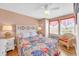 Relaxing bedroom with hardwood floors, two windows, and a comfortable chair at 329 54Th Ave. N, North Myrtle Beach, SC 29582