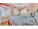 Cozy bedroom with twin beds, bright windows, and a flat-screen TV on the wall at 329 54Th Ave. N, North Myrtle Beach, SC 29582