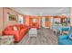 Open-concept living room and dining area with wood floors and plenty of space for entertaining at 329 54Th Ave. N, North Myrtle Beach, SC 29582