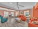 Spacious living room with wood floors, lots of natural light, and comfortable seating arrangements at 329 54Th Ave. N, North Myrtle Beach, SC 29582